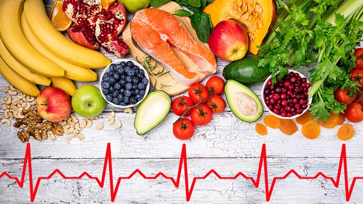 A group of fruits and vegetables accompanied by an ecg line, highlighting the benefits of intermittent fasting.
