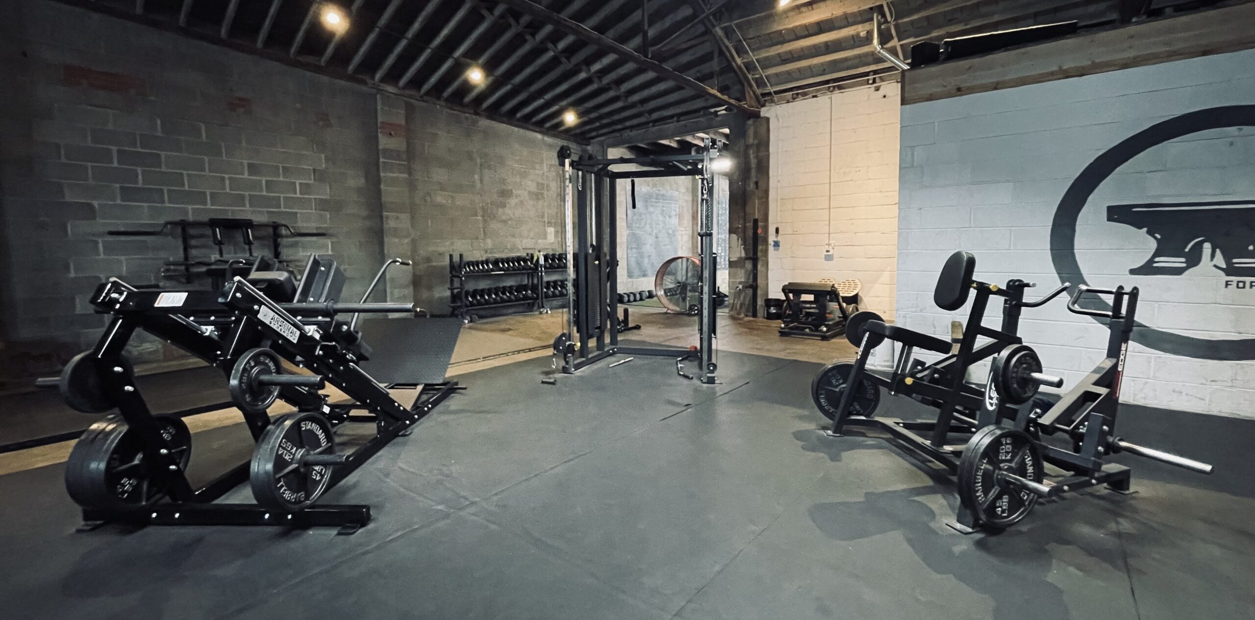 A picture of forge fitness studio gym with a lot of equipment in it